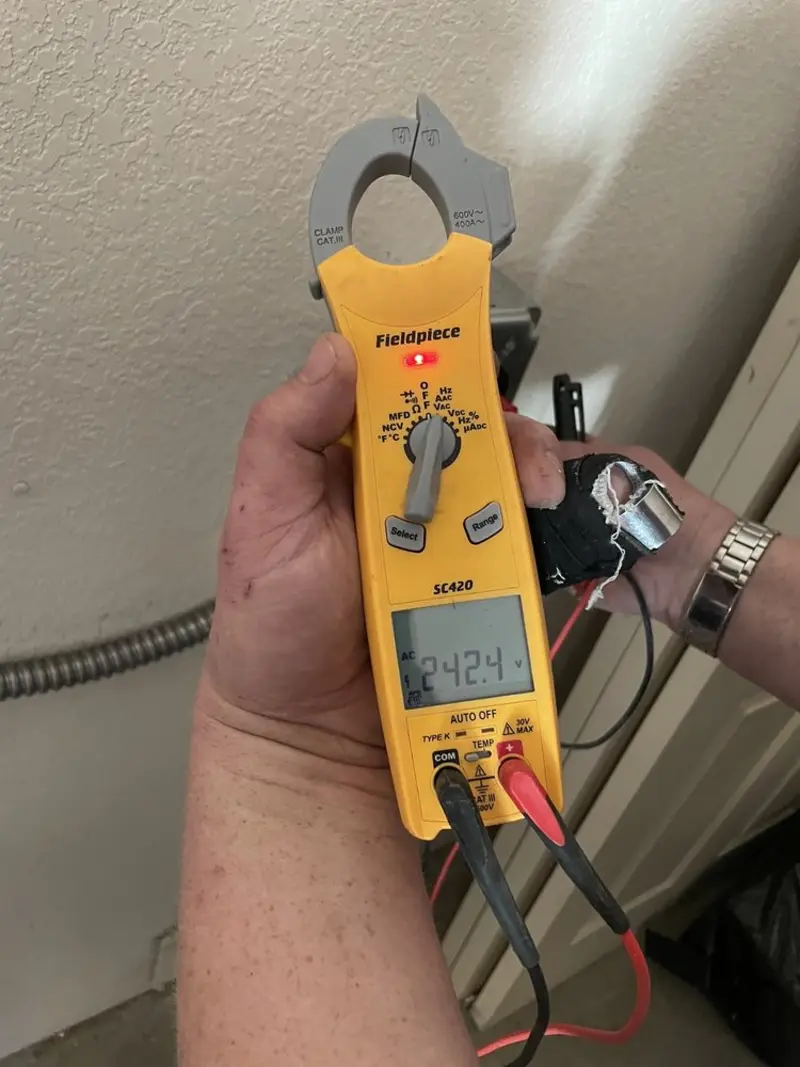 Voltage testing with clamp meter during Whole House Surge Protector in Shady Cove